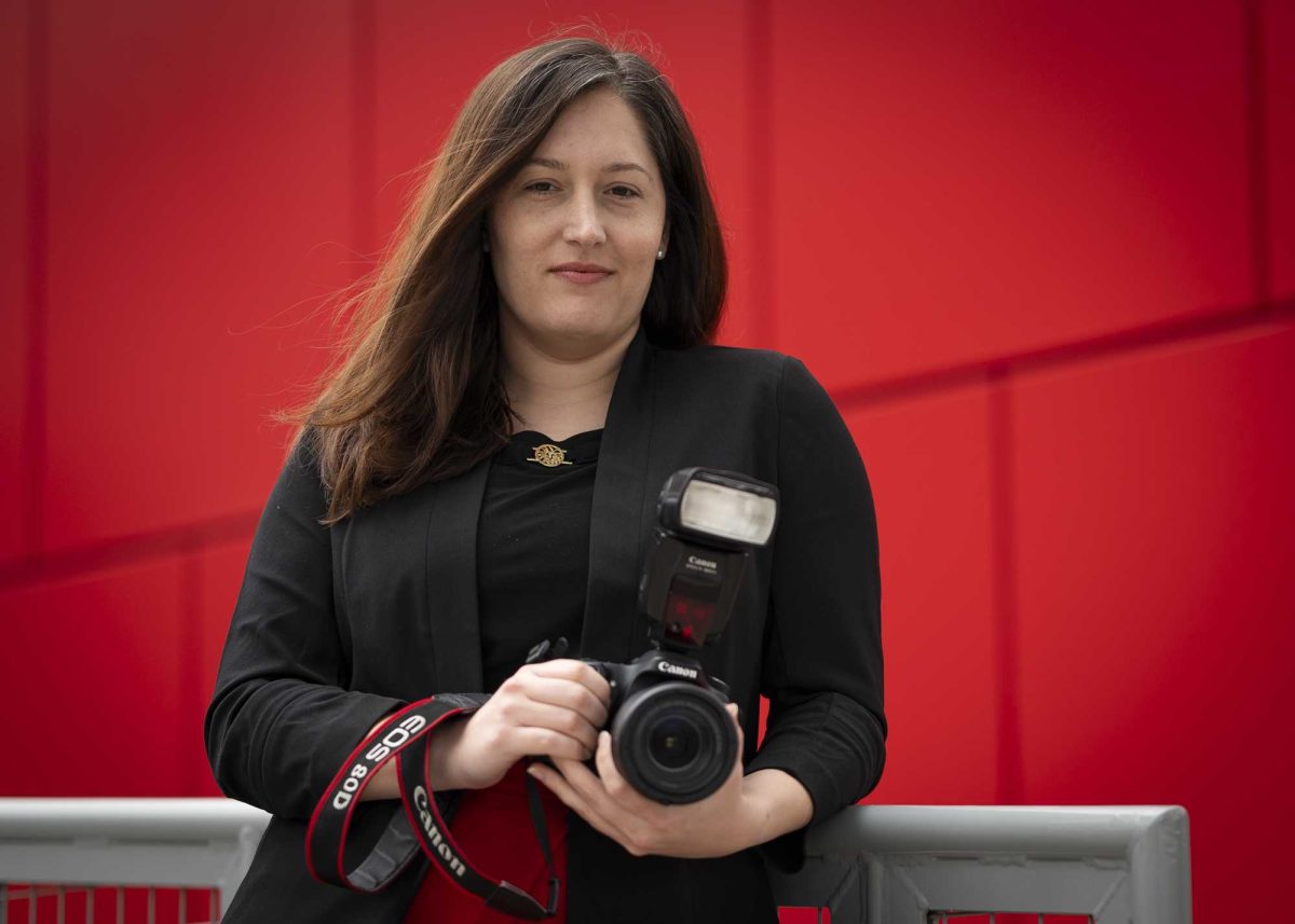 SAC alum Virginia Finster works as a marketing content creator in the college's Office of Marketing and Strategic Communications. Photo by Jasmine Valero. 