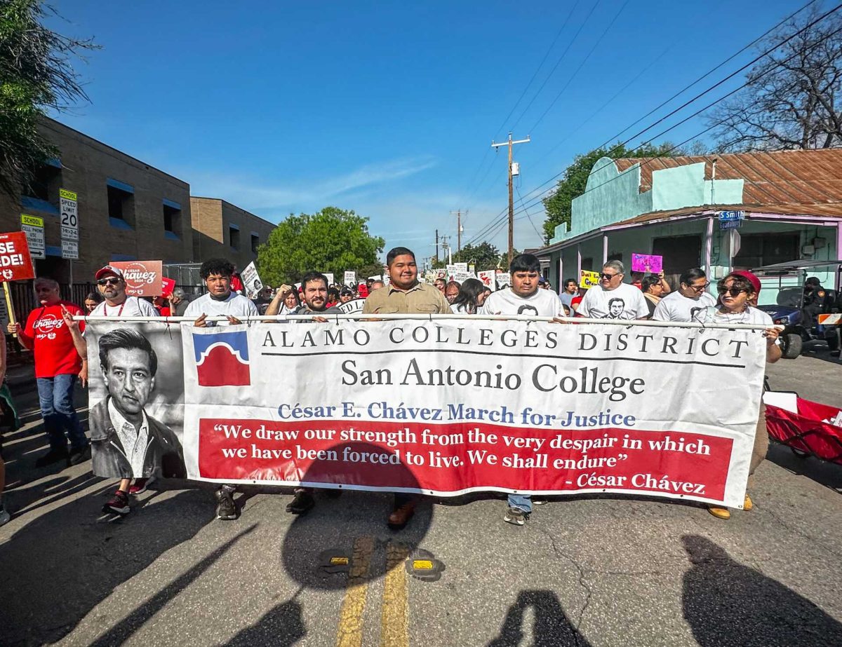 San Antonio College representatives carry a district banner during the 28th annual Cesar E. Chavez March for Justice in downtown San Antonio March 23. SAC students and staff paid tribute to Chavez's legacy of labor organizing and activism. Photo by Armani Martinez.