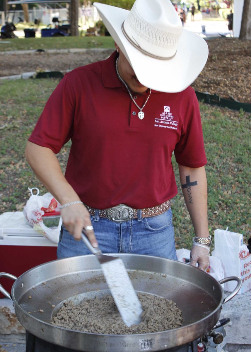 Jayden Correa, vice president of the San Antonio College Men Empowerment Network (SACMEN), cooked and sold tacos at the Antojitos Festival in the mall area Sept. 25 to raise funds for the club. “I like that this brings everyone together, and exposes our culture to more people,” Correa said. Photo by Pablo Viveros