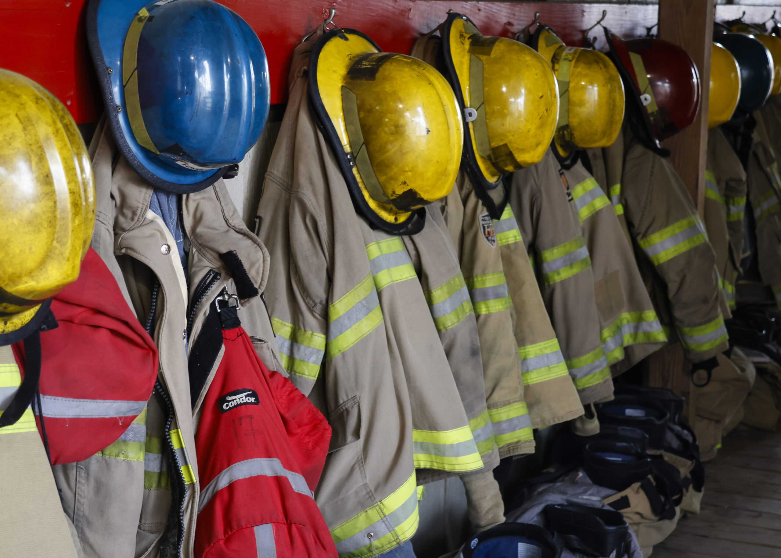 Firefighting gear hangs in a storage area at SAC’s Fire Academy. Photo by Natalia Edwards.