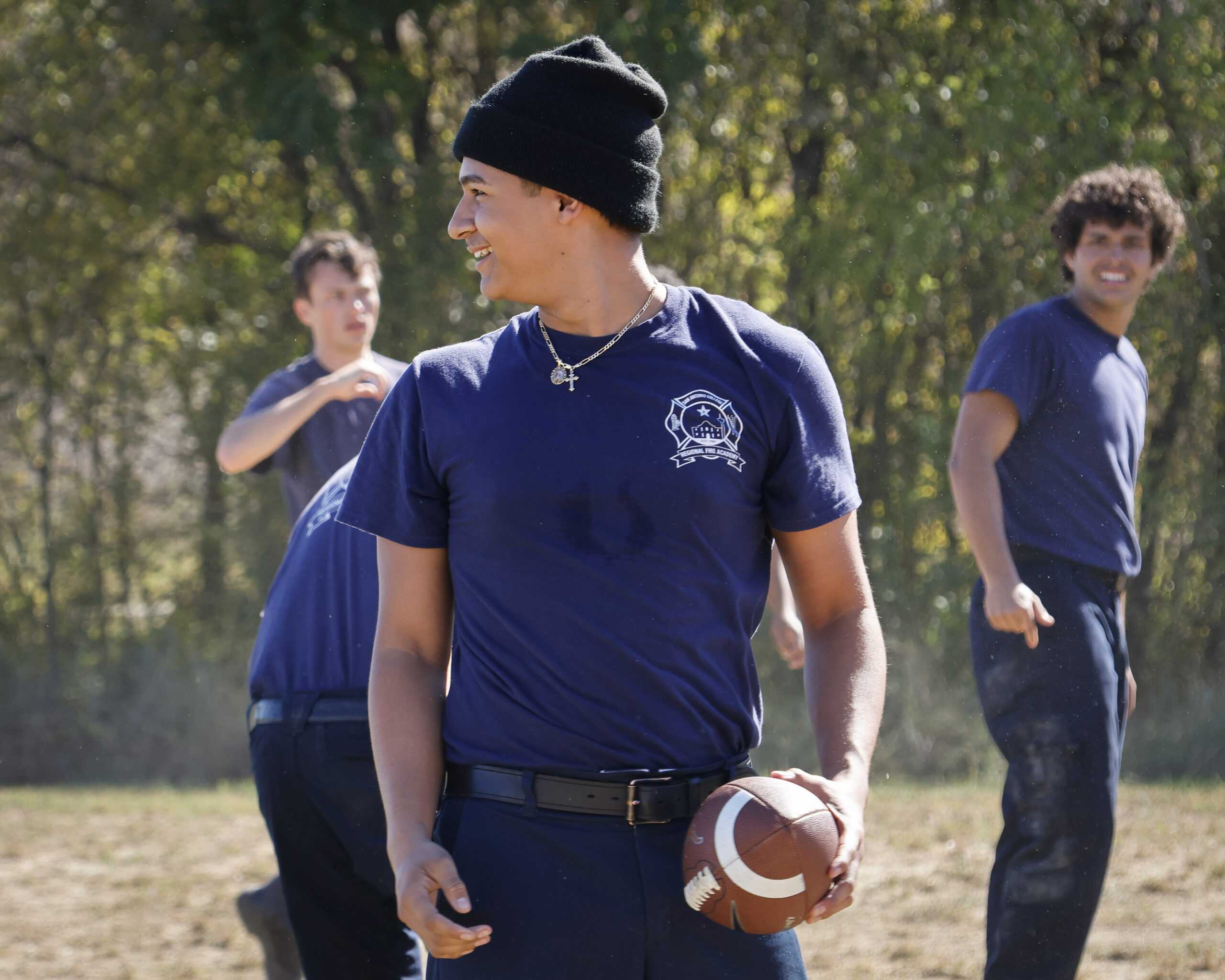 Fire Academy cadets play football during a Thanksgiving lunch break. Photo by Natalia Edwards.