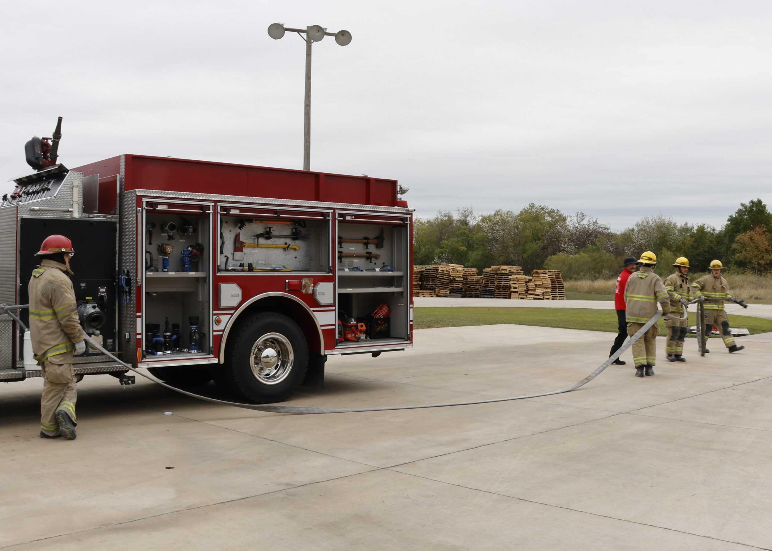 Fire Academy cadets complete the extinguishing portion of their State Exams. Photo by Natalia Edwards.