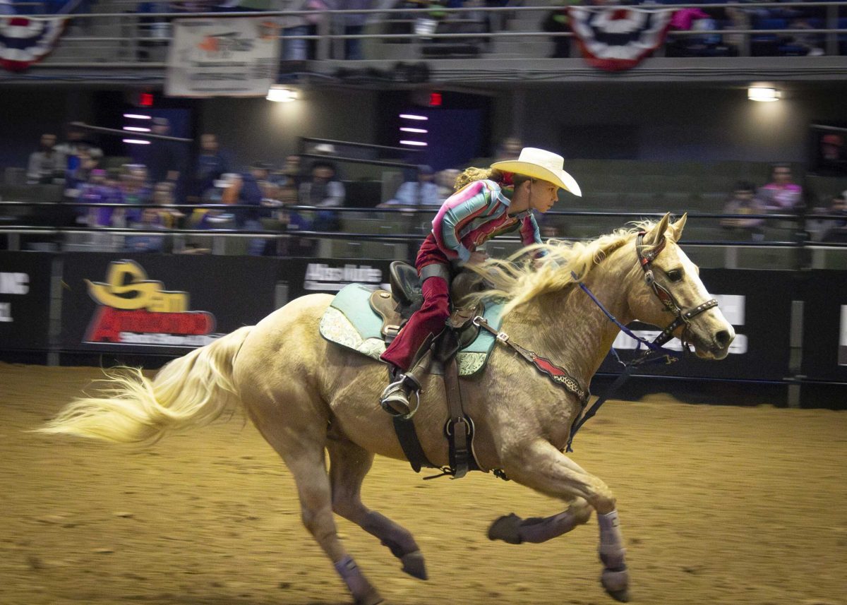 A youth barrel racer finishes her race at the San Antonio Stock Show and Rodeo Feb 12. Photo by Catie Broadus.