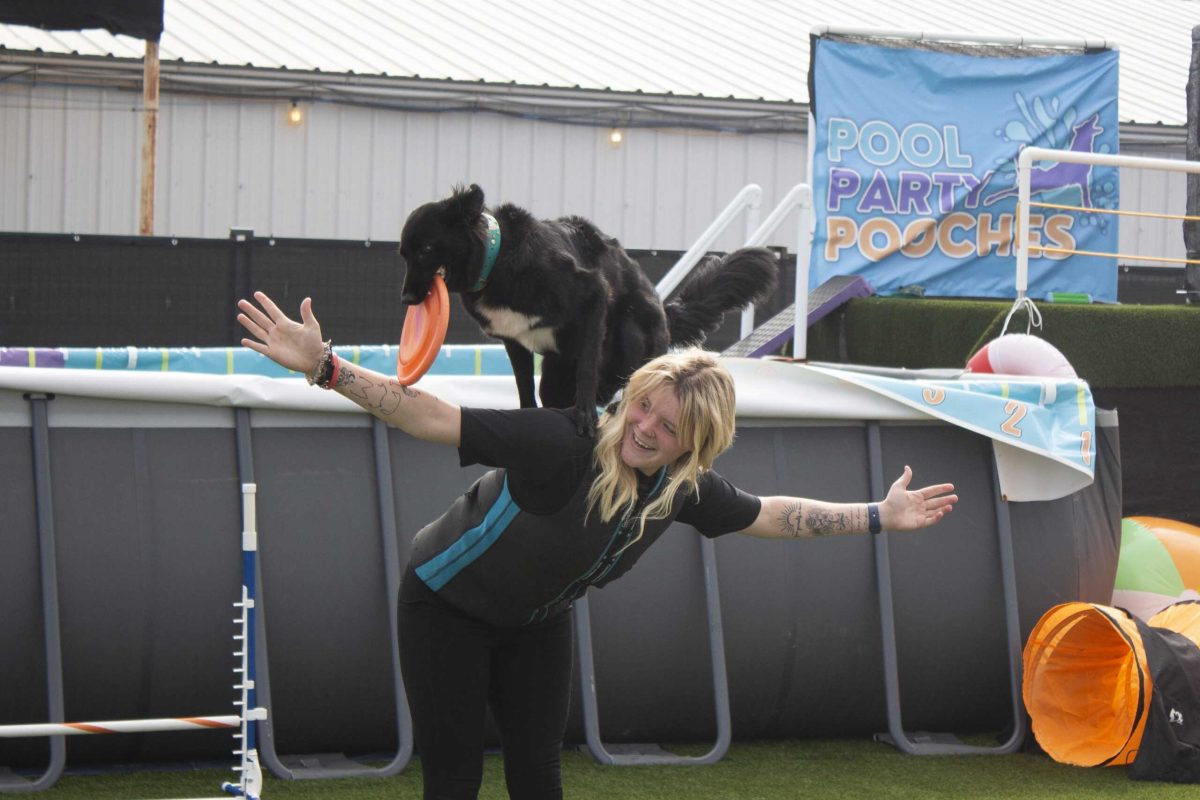Macy and her dog, Daisy, perform tricks during the Pool Party Pooches event at the San Antonio Stock Show and Rodeo Feb. 12. Photo by Daniel De Leon II.