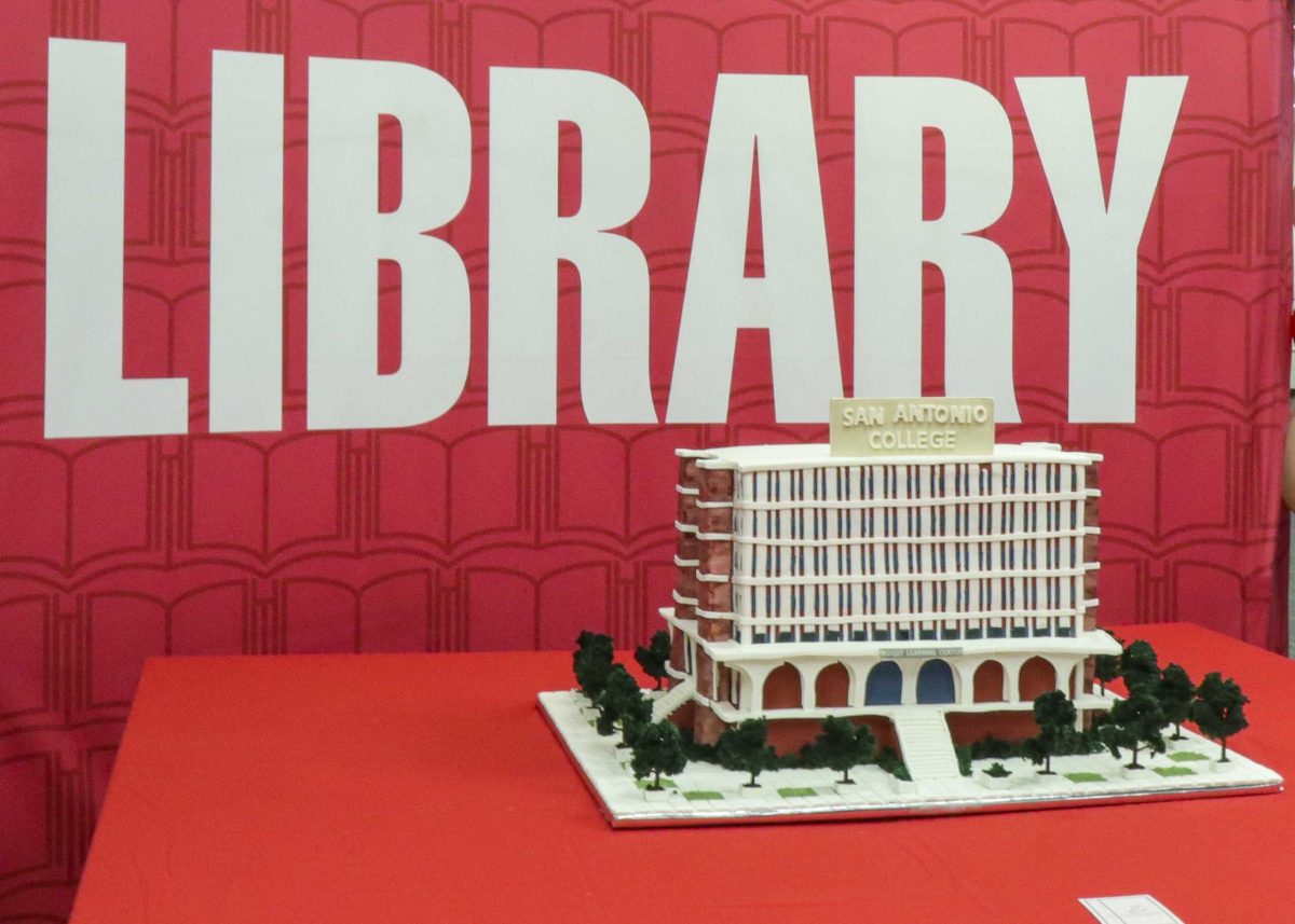 A cake designed as Moody Learning Center was one of the features at the SAC’s “Pages Through Time” birthday celebration Wednesday in the library. Staff, faculty members and students celebrated the library's 100-year journey through the lens of technological evolution. Photo by Monica Lee Perez.