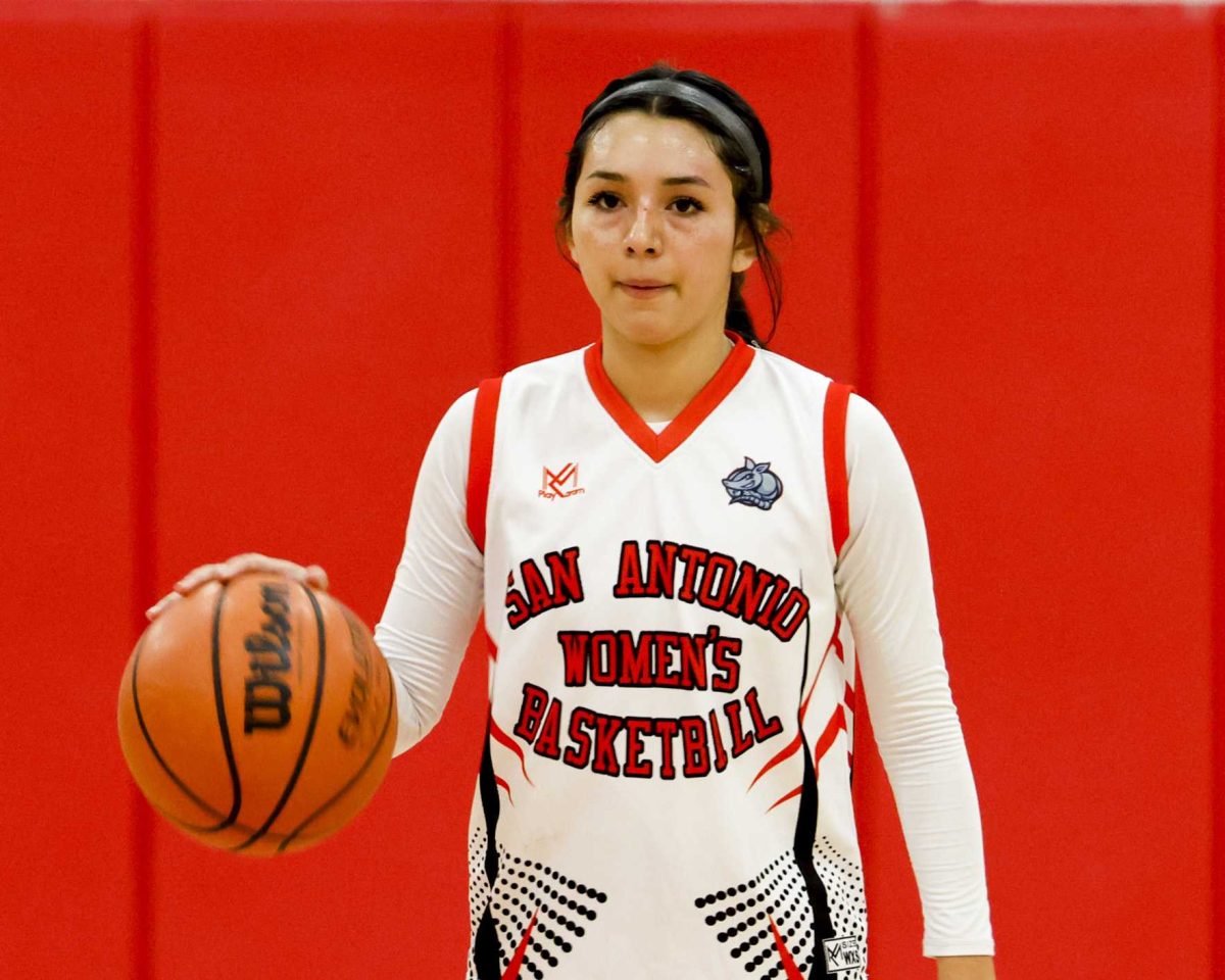 SAC Point Guard Alexis Castillo brings the ball up the court Wednesday against St. Philip’s College. Photo by Charles Hopper.