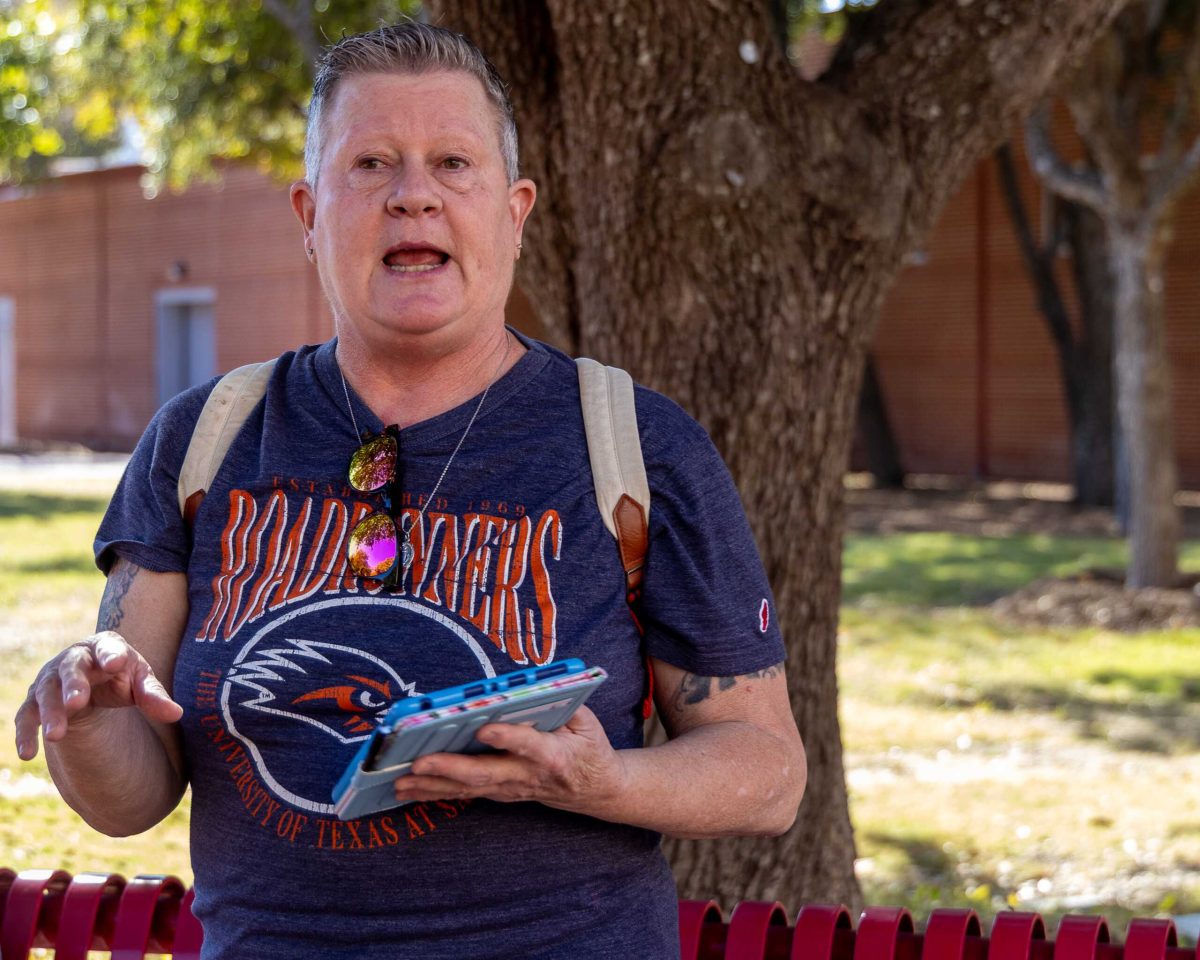 UTSA Historian and Archivist Melissa Gohlke leads a walking tour of San Antonio's historic LGBTQIA+ landmarks Nov. 12. Photo by Chris Hernandez.